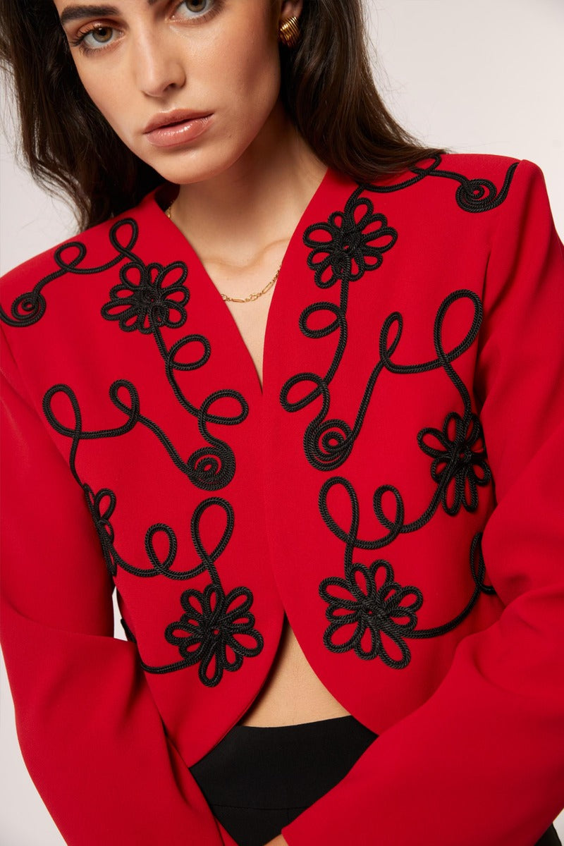 Red Señorita Rosalia jacket with stylish design and fitted silhouette, shown on a model.