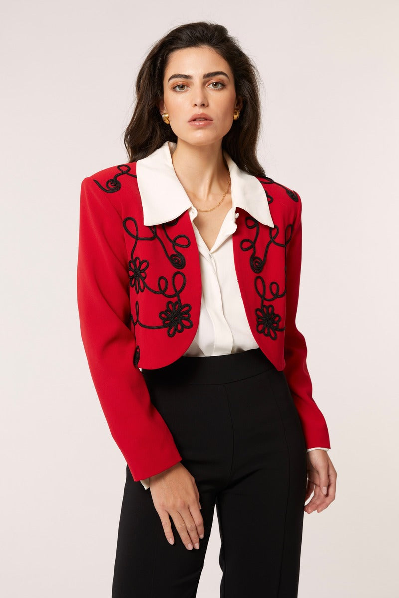 Red Señorita Rosalia jacket with stylish design, featuring a fitted silhouette and detailed stitching, perfect for casual wear.