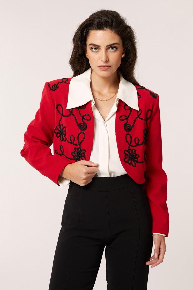 Red Señorita Rosalía jacket with stylish design, featuring a tailored fit and vibrant color, perfect for casual or semi-formal wear.
