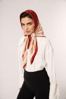 Red Señorita Luisa scarf featuring soft fabric and stylish drape, perfect for accessorizing your outfit.