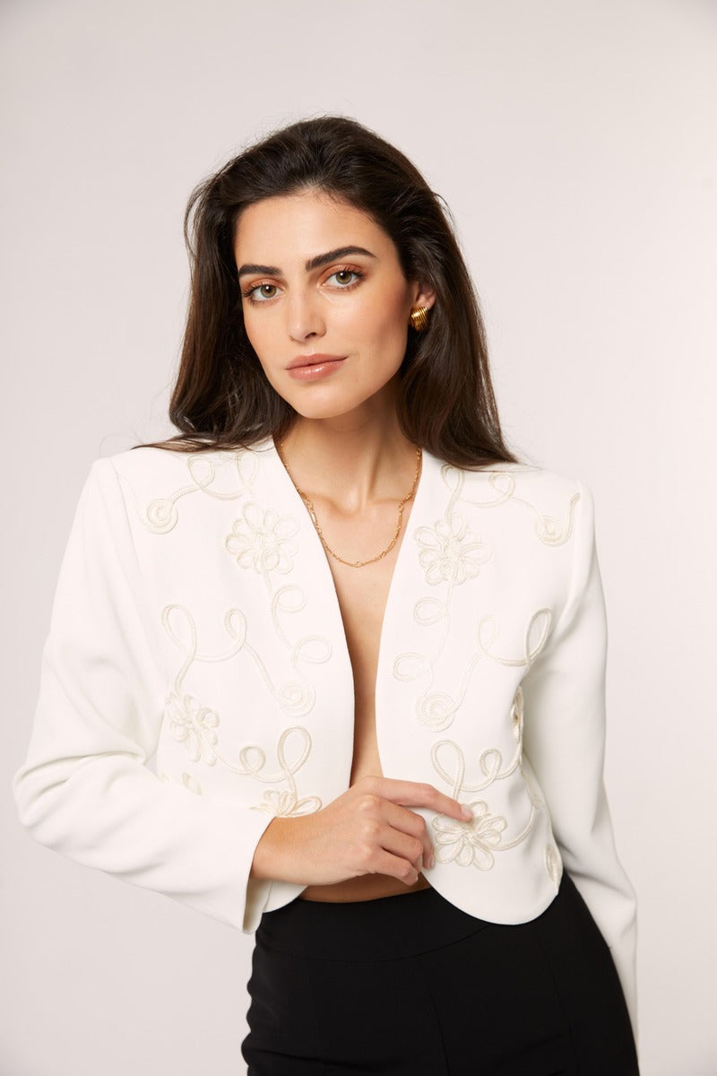 Señorita Maria blazer in white, tailored women's blazer with lapels and button closure on a hanger.