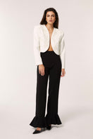 Señorita Maria blazer in white displayed on a hanger, showcasing tailored fit and classic blazer style with lapel collar.