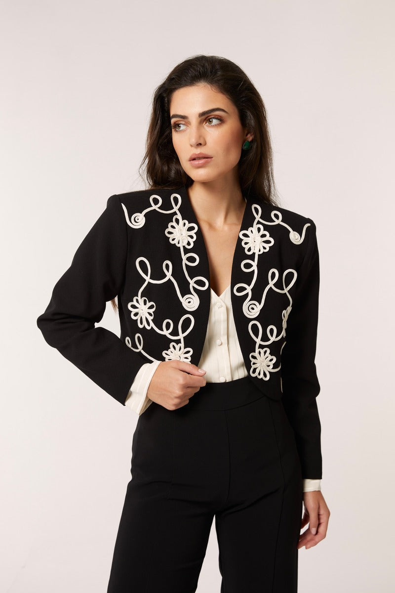 Señorita Maria blazer in black and white, tailored blazer with a fitted style and classic lapel, displayed on a hanger.