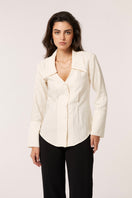 Señorita Alba Ivory Blouse, a stylish women's shirt with a soft fabric and elegant design, displayed on a hanger.
