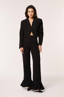 Señorita Eugenia black pants displayed on model, featuring a tailored fit and sleek design for versatile styling.