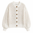 First Born Knits Elara cardigan displayed in a cozy, knitted fabric with a stylish design and button details.