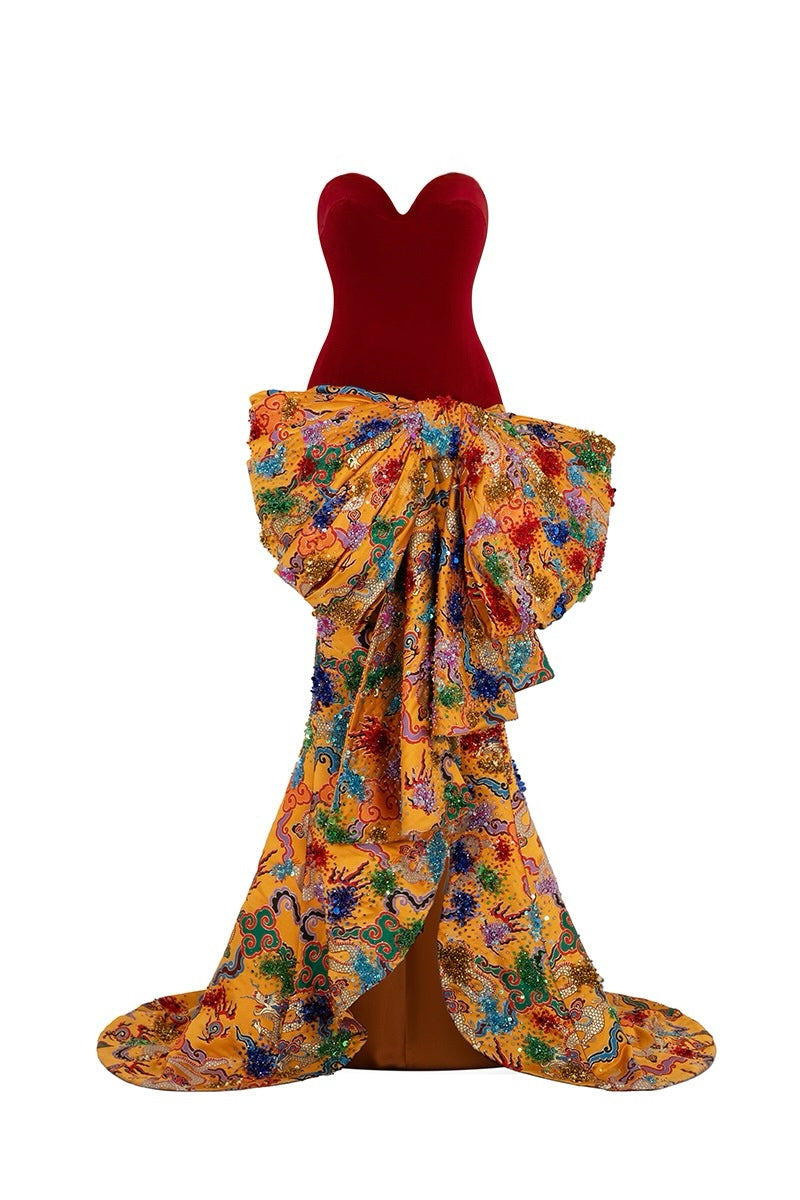 Elegant Imperial Bow gown by Le Thanh Hoa featuring intricate details and a flowing silhouette, displayed on a mannequin.