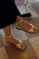 ALTA Conno Gold Sandals featuring metallic gold straps and open-toe design, perfect for casual or summer wear.