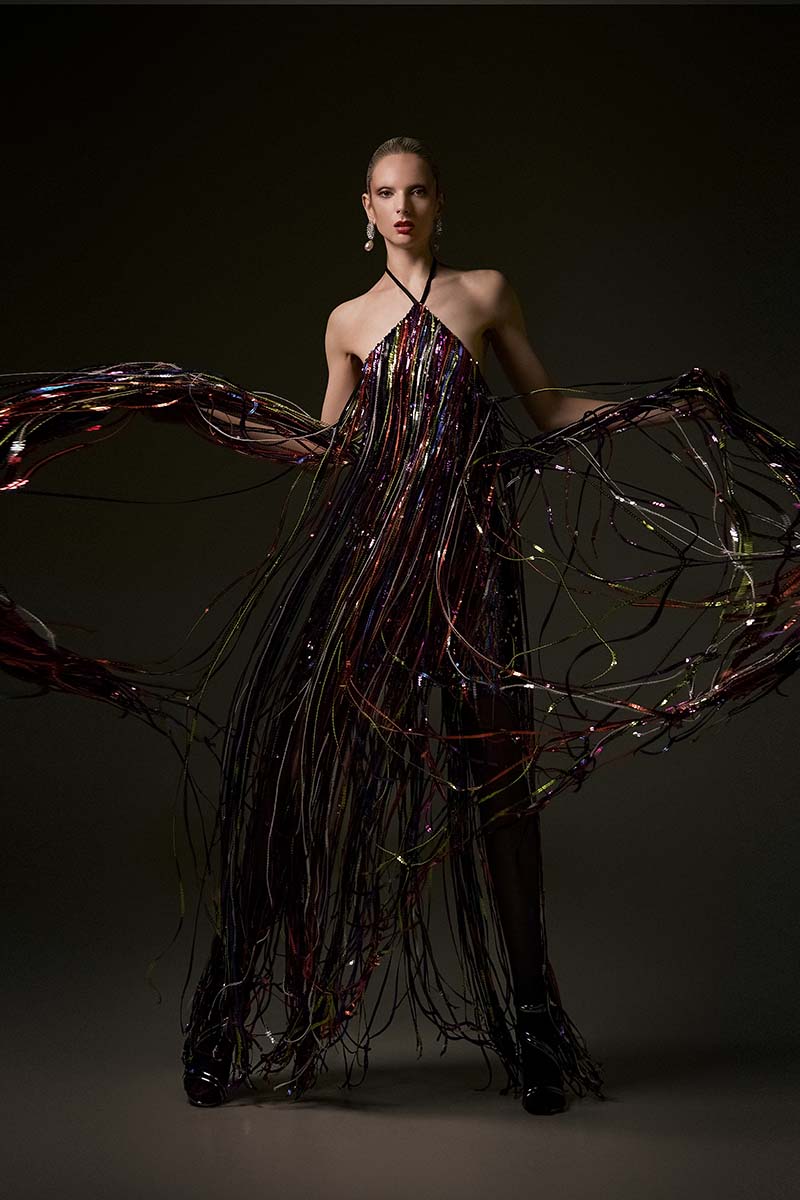 Elegant Marilyn gown by Alersundi featuring intricate lace details and flowing fabric, perfect for formal occasions.