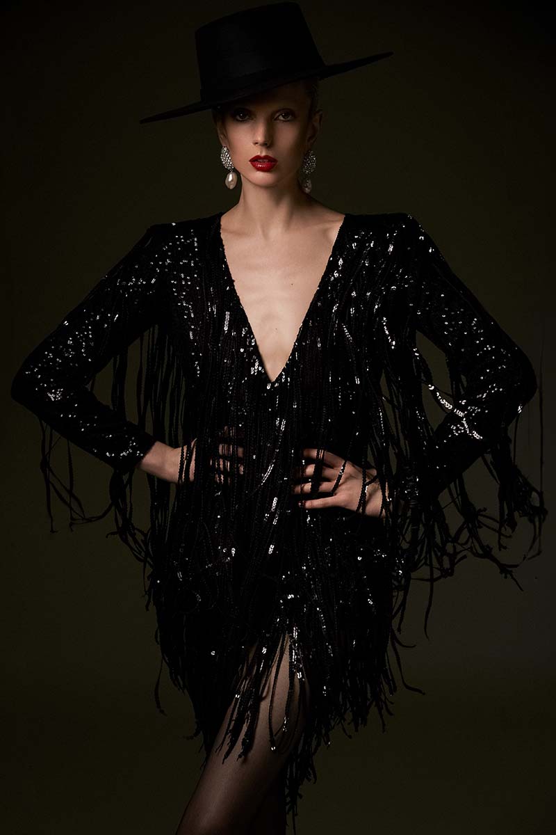 Alersundi Donna jumpsuit in stylish fabric, featuring a fitted waist and wide-leg design, displayed on a hanger.