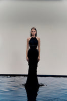 Black VEYA gown by Francisco Arce featuring elegant design and flowing fabric, perfect for formal occasions.