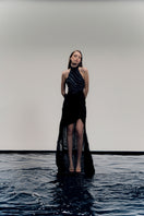 Francisco Arce black gown named LYRA DRESS, elegant floor-length dress with a fitted bodice and flowing skirt.