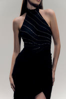 Black LYRA gown by Francisco Arce featuring elegant fabric and tailored fit, perfect for formal occasions.