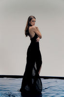 Elegant black gown by Francisco Arce featuring a flowing design, perfect for formal occasions, shown in the LYRA DRESS product image.