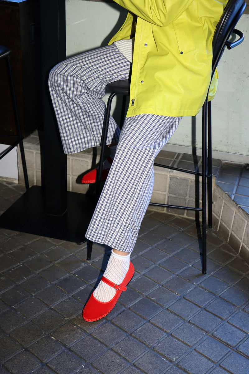 Flabelus Mellark red flats with matching red piping, stylish slip-on footwear for women, shown from a front angle.