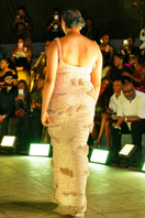 Onalaja Zellie slip gown in cream, lightweight and elegant, displayed on a hanger with soft fabric details visible.