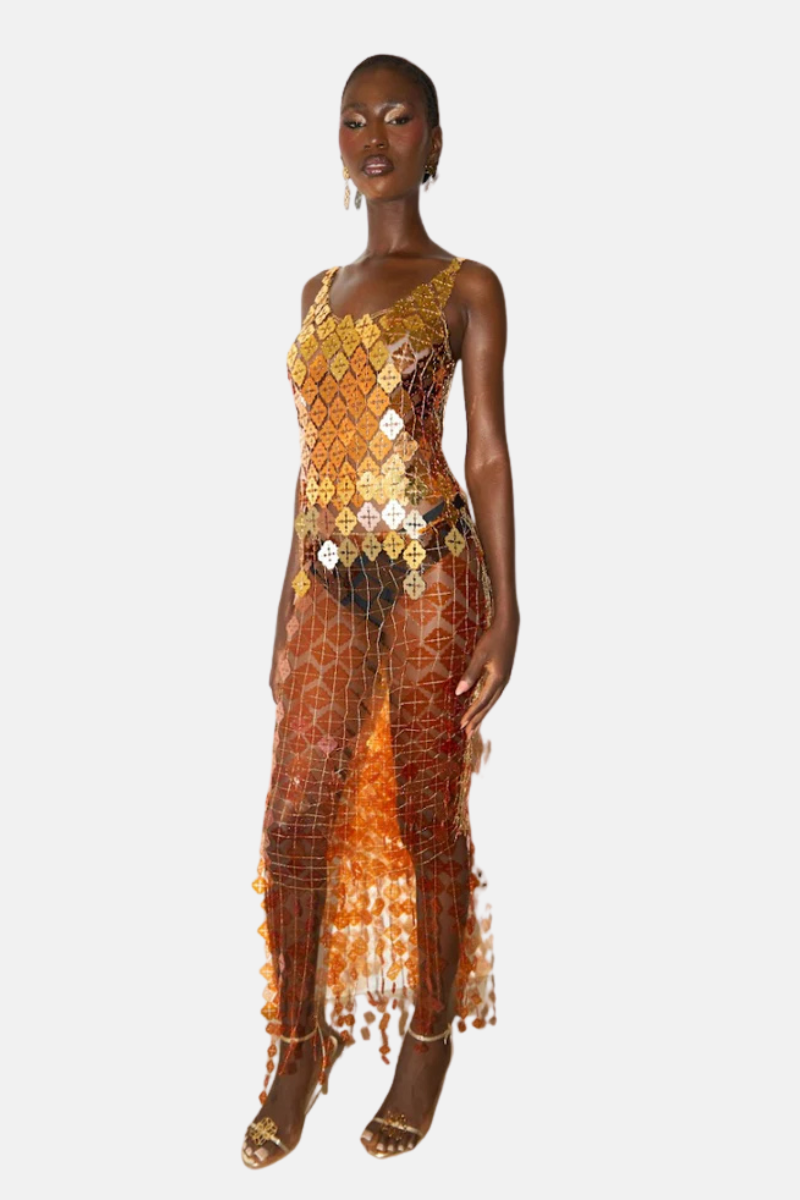 Onalaja sequin emblem midi skirt with shiny embellishments and elegant design, showcased on a model.