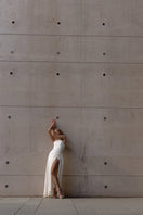 Monetre sculptural corset gown with structured design, intricate detailing, and flowing fabric for elegant evening wear.