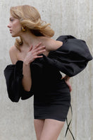 Black lace-up corset with meringue flounces, stylish tops by Monetre featuring intricate lace details and feminine ruffle accents.