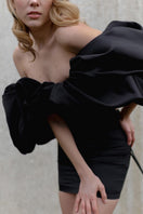 Black lace-up corset with meringue flounces, stylish tops by Monetre, featuring intricate lace details and playful ruffle accents.