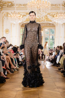 Alersundi Silvia black gown featuring elegant fabric and a flowing design, perfect for formal occasions.