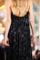 Elegant black Melissa gown by Alersundi, flowing fabric with a fitted bodice and stylish design, perfect for formal occasions.