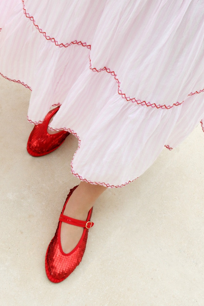 Red Pierre sequins flats by Flabelus with shimmering sequin details and a sleek flat design for stylish comfort.