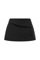 Arti Apparel Ontario mini skirt in denim, featuring a high-waisted design and front pockets, displayed on a hanger.
