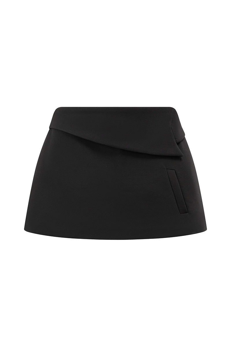 Arti Apparel Ontario mini skirt in denim, featuring a high-waisted design and front pockets, displayed on a hanger.