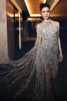 Alersundi Maria gown featuring elegant fabric and intricate design, displayed on a mannequin for formal evening wear.