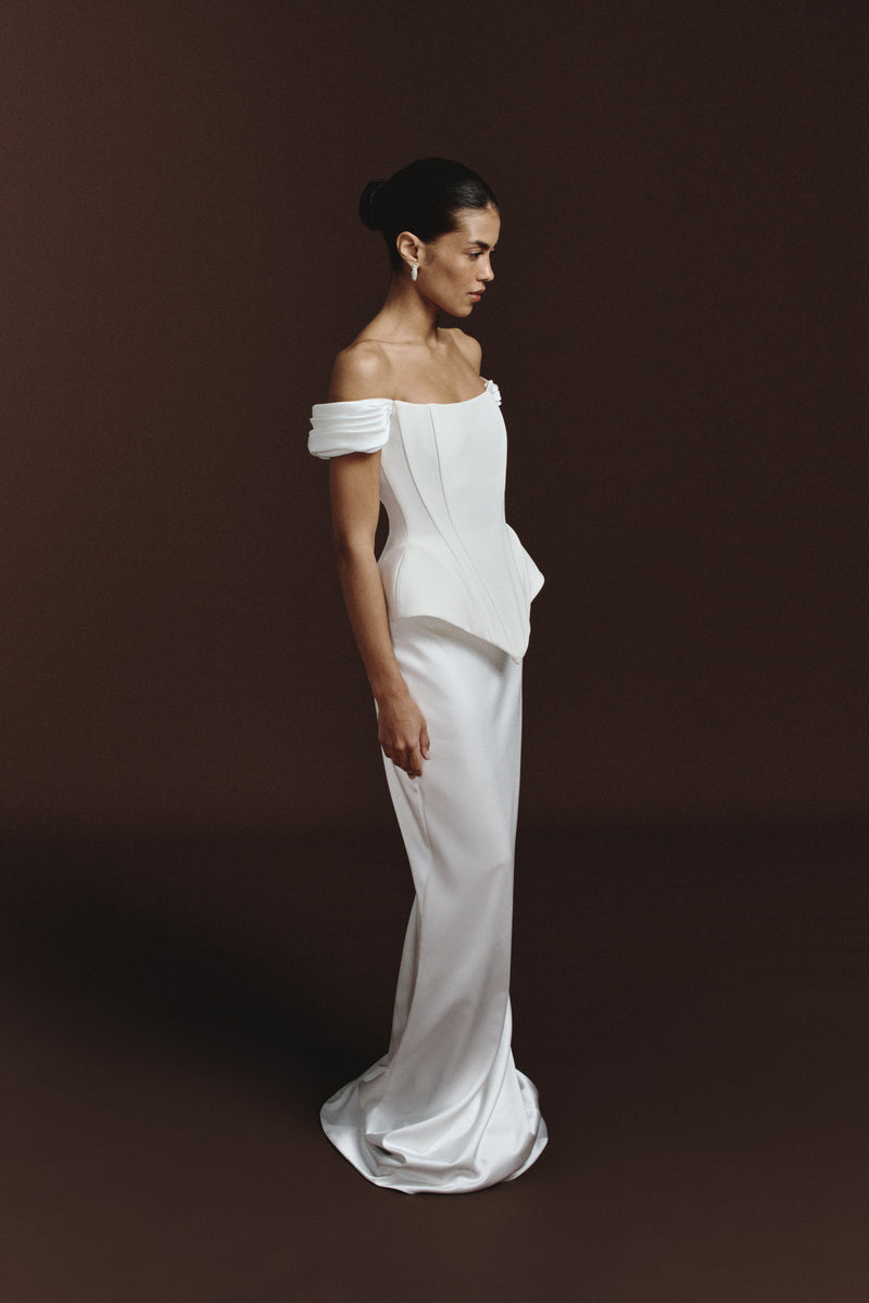 BalYKINA Laylah soft satin maxi skirt draped elegantly, showcasing smooth fabric and flowing silhouette.