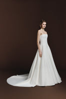 BalYKINA Gabby matte silk gown displayed on a model, featuring elegant design and flowing fabric for formal occasions.