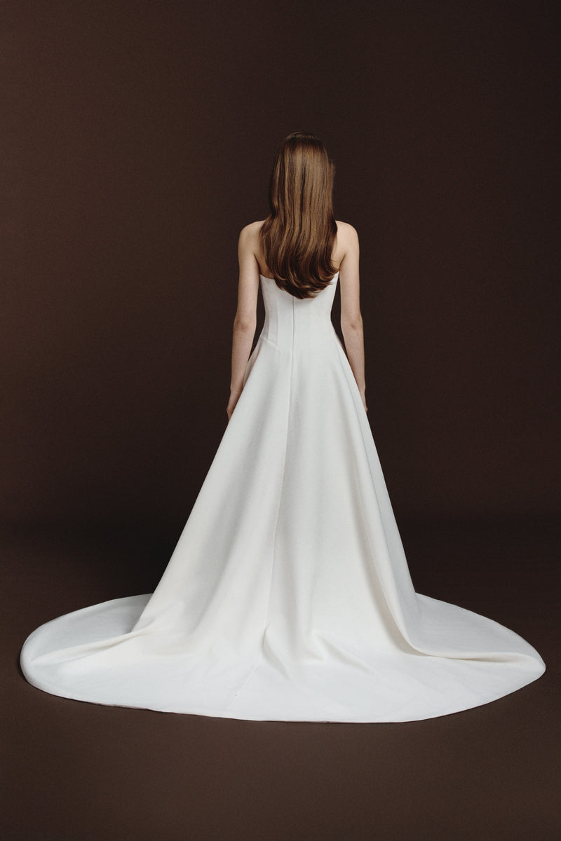 BalYKINA Gabby matte silk gown with elegant drape and fitted waist, shown in a stylish, flowing design.