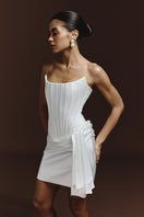 BalYKINA Irma mini dress with floral pattern, sleeveless design, and fitted silhouette, showcased on a model.