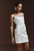 BalYKINA IRMA mini dress showing a stylish, fitted design with a vibrant pattern worn by a model.