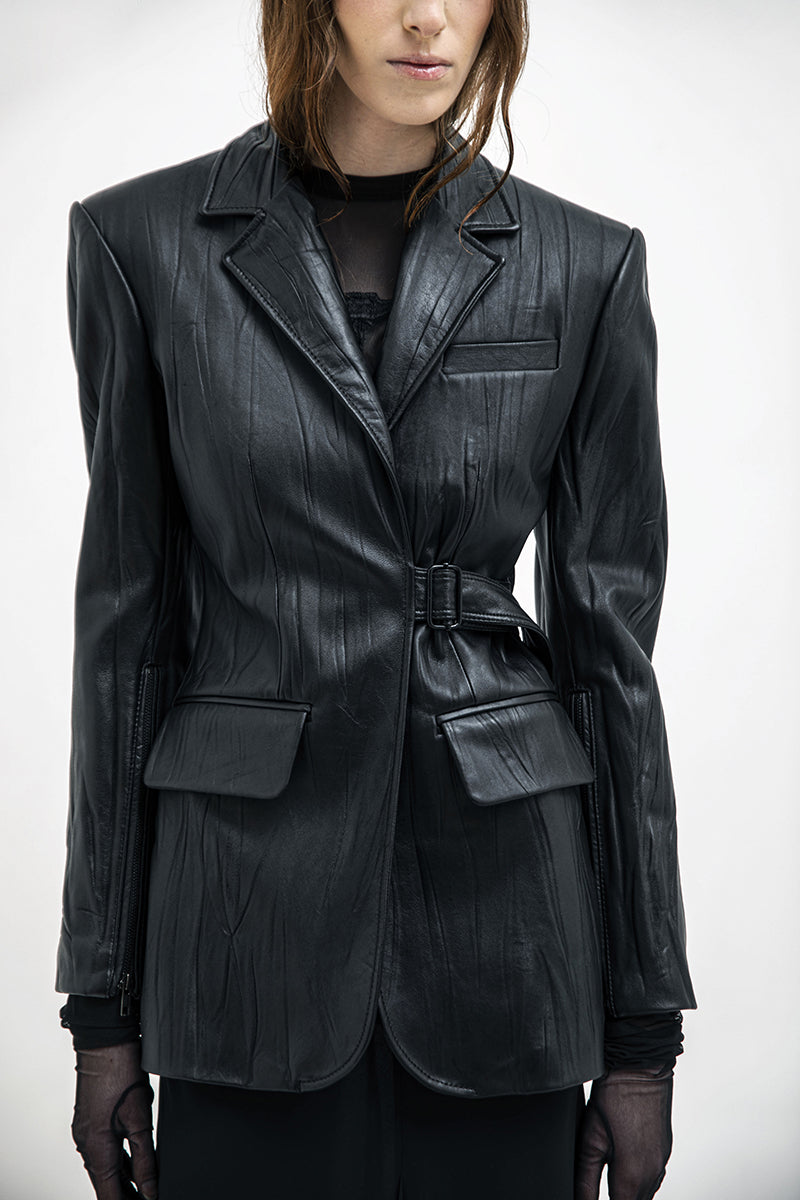 Black textured leather jacket from Vaska featuring a stylish, fitted design with detailed stitching and a classic collar.