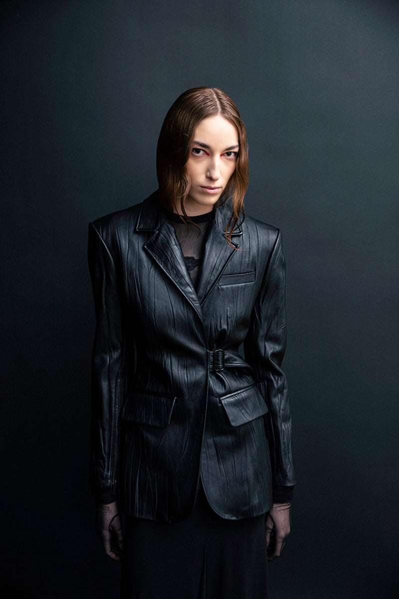 Black textured leather jacket by Vaska featuring a stylish, fitted design and classic collar detail.