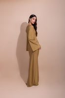 Laura Escobar BARÚ Gold Long Maxi Dress with elegant flowing fabric and intricate gold detailing.