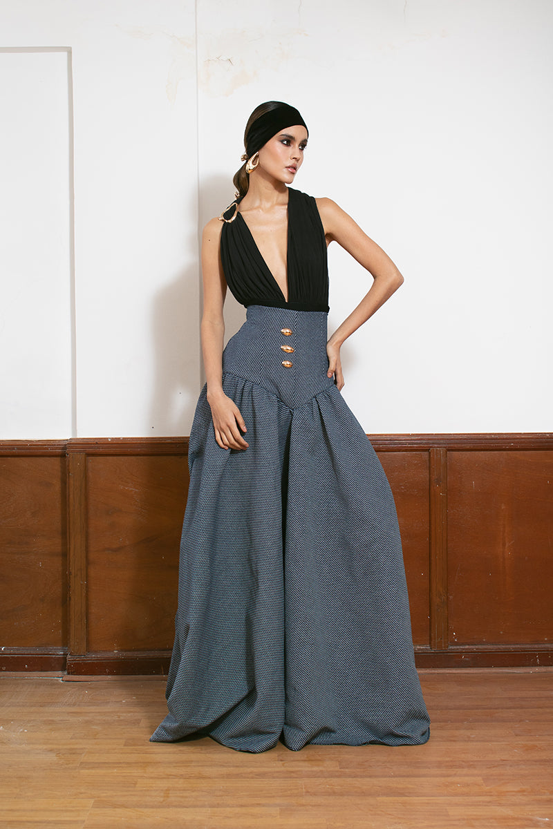 LEDIEL Palacio Maxi Skirt featuring flowing fabric and elegant design, displayed on a hanger.