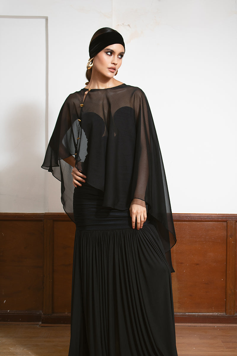 LEDIEL MYNA Cape jacket displayed on a hanger, showcasing its stylish design and fabric texture.