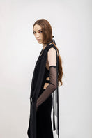 Black Vaska jacket with chiffon ribbon details, stylish and elegant outerwear for a sophisticated look.