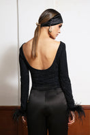 LEDIEL PLUMA TOP, stylish women's blouse with a flowing design and elegant details, seen in a front view.