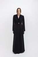 Black Vaska long trench jacket with front zippers, stylish and modern outerwear for a sleek, urban look.