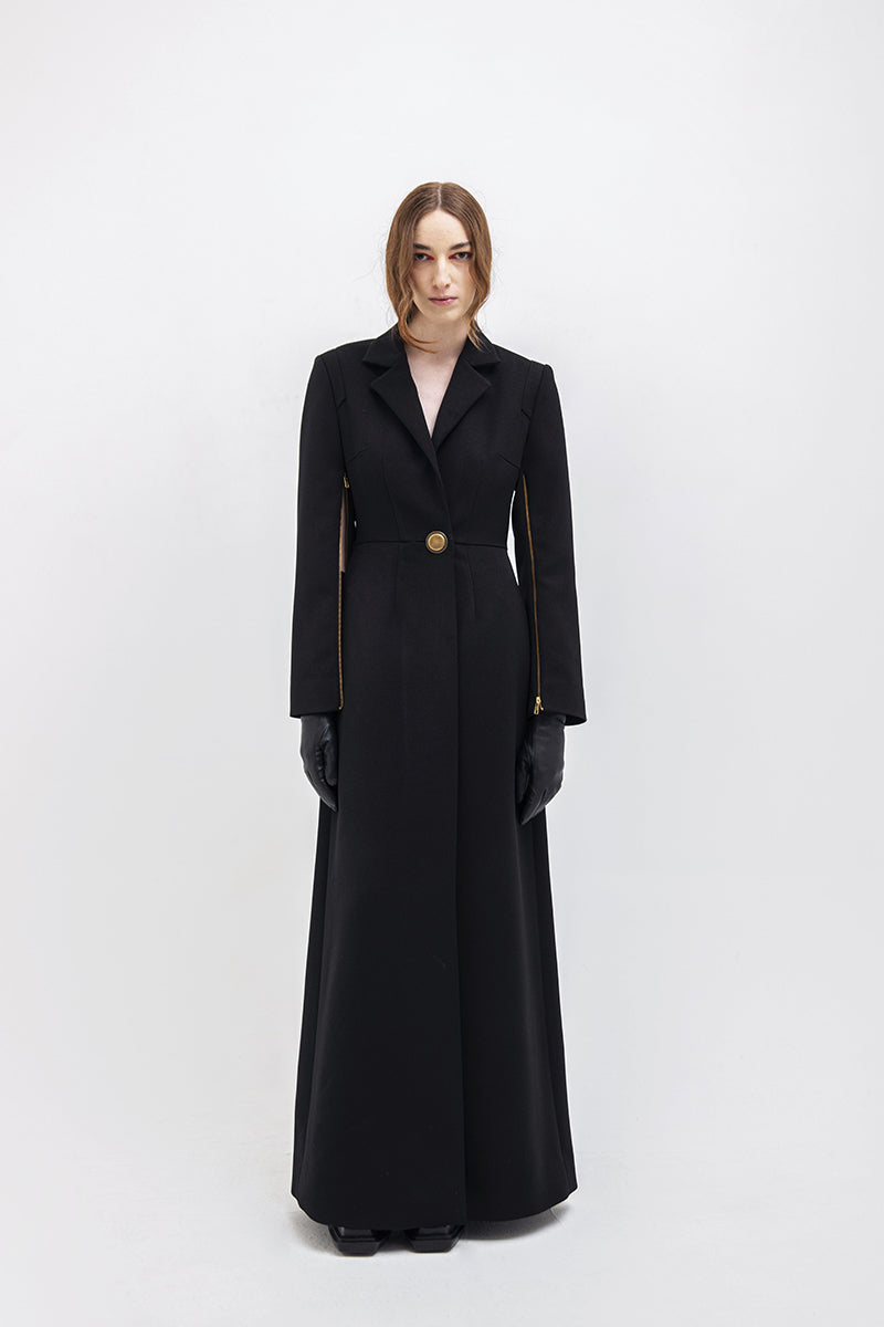 Black Vaska long trench jacket with front zippers, stylish and modern outerwear for a sleek, urban look.