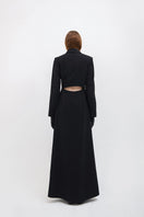 Black Vaska long trench coat with zippers, stylish and sleek jacket featuring modern design and zipper details.