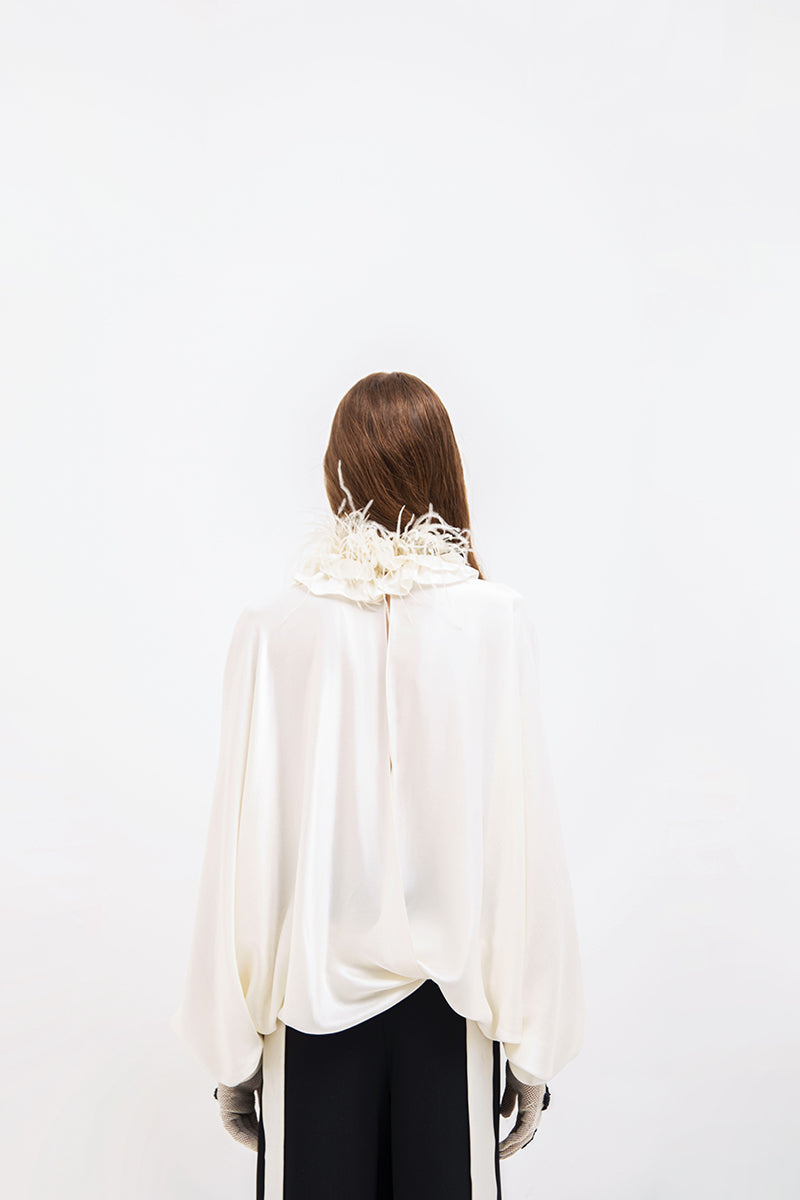 Beige Vaska feather-embellished blouse with long sleeves, stylish and elegant shirt for women.