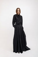 Black wide-leg pants by Vaska, showing the flowy fabric and relaxed fit, perfect for casual or stylish outfits.