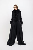 Black Vaska crop jacket with ruffles, stylish women's jacket featuring a trendy ruffled design and fitted silhouette.