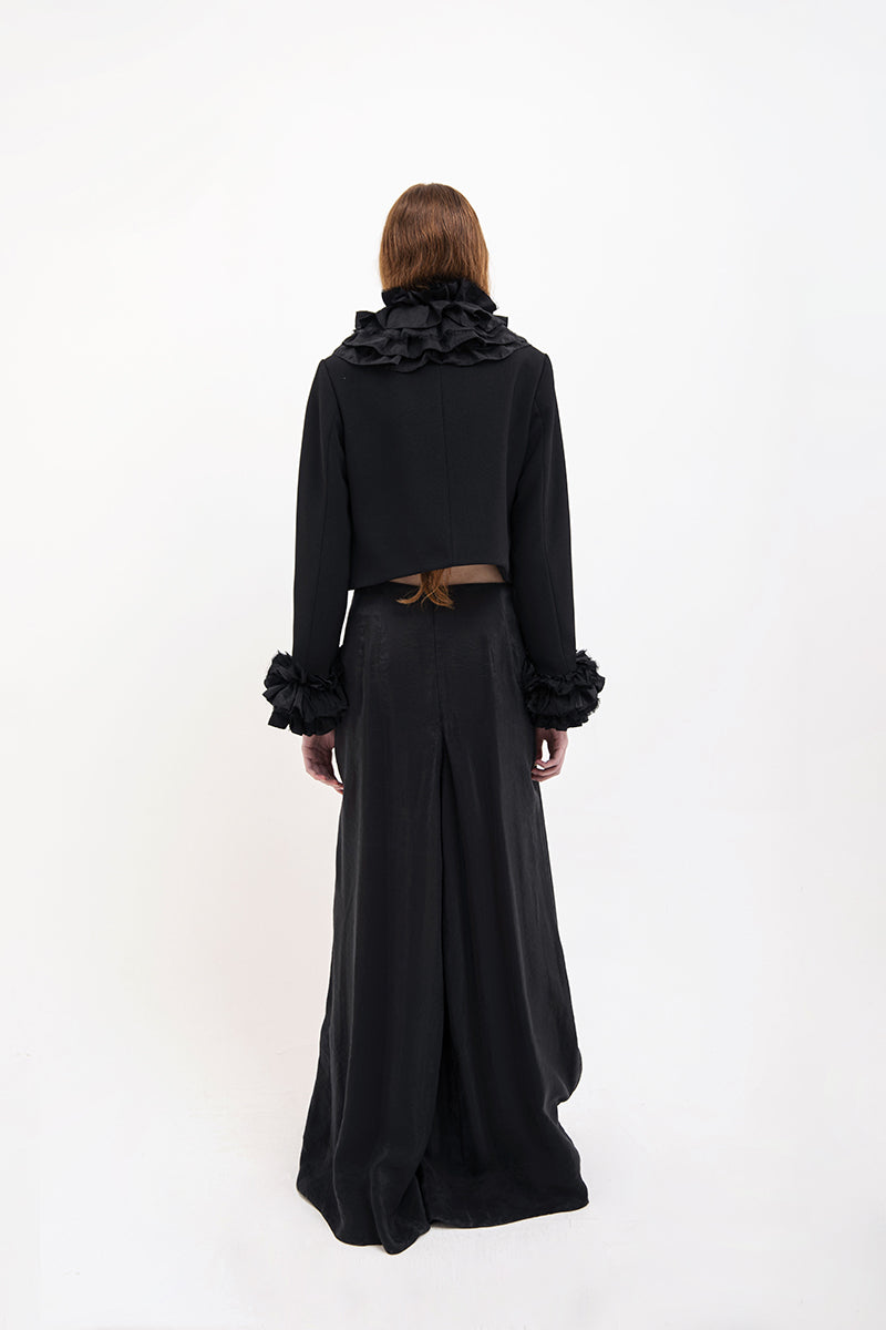 Black Vaska crop jacket with ruffles, stylish women's jacket featuring feminine ruffle details and a fitted silhouette.