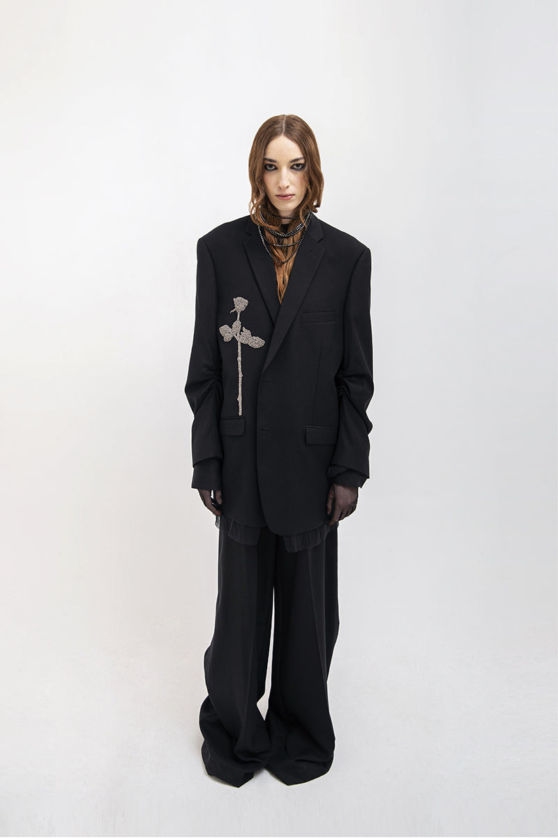 Black oversized blazer by Vaska featuring intricate beaded embroidery, stylish and suitable for contemporary fashion.
